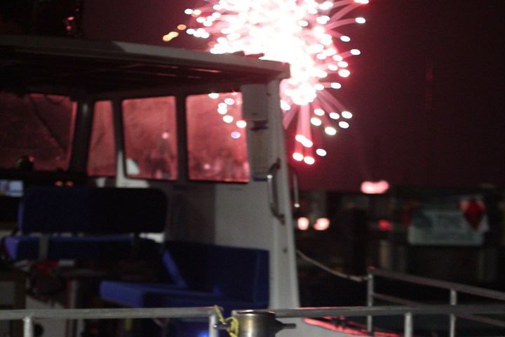 fireworks behind boat