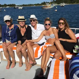 group smiling on boat