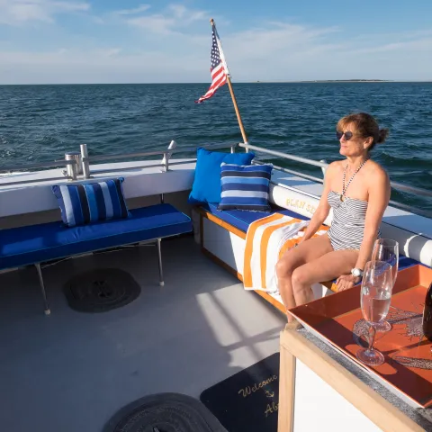 woman on back of boat