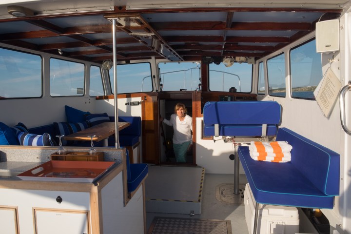woman walking up stairs of boat