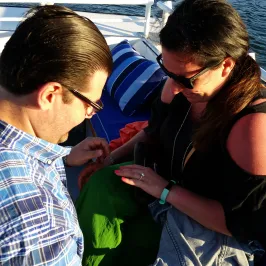 man proposing on boat