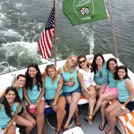 group of girls on back of boat
