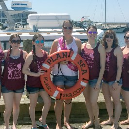 bachelorette party posing on the dock