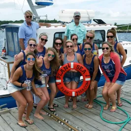 girls posing on dock