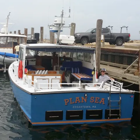 Boy Sitting on Plan Sea Boat