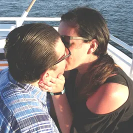 couple kissing on boat