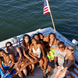 group posing on back of boat