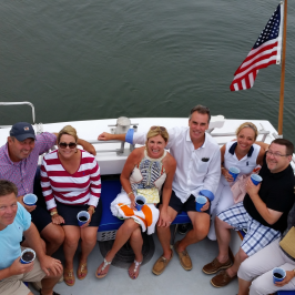 group posing on back of boat