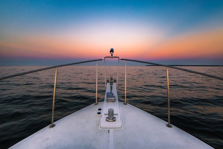 sunset view from the nose of the boat