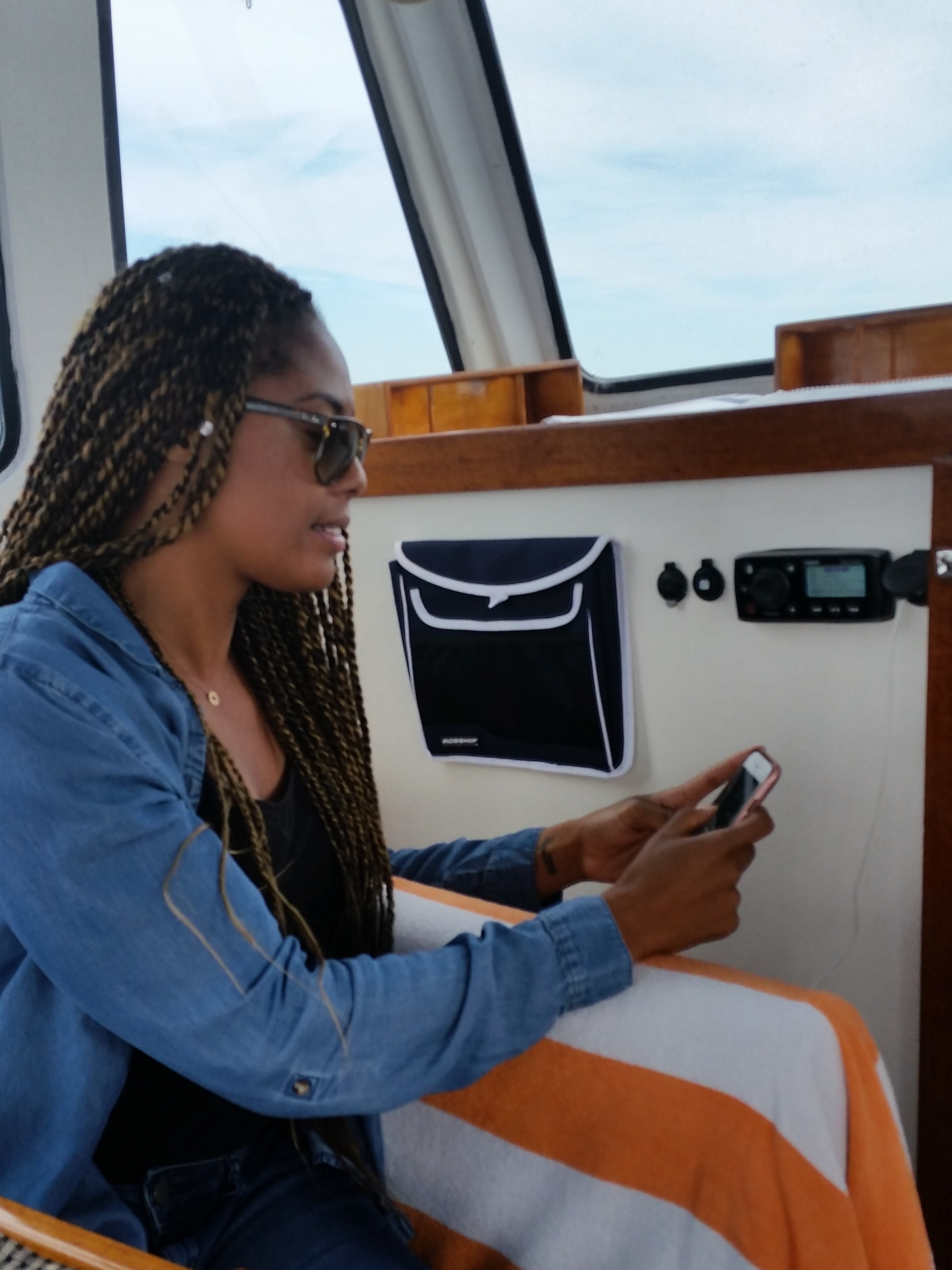 girl taking pictures on the boat