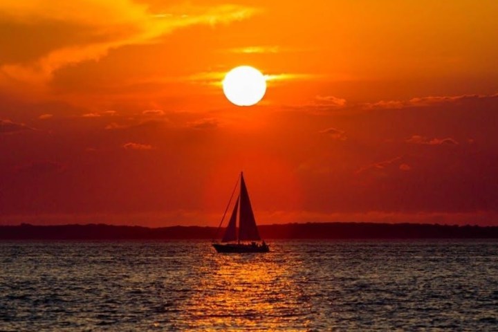 a sunset over a body of water